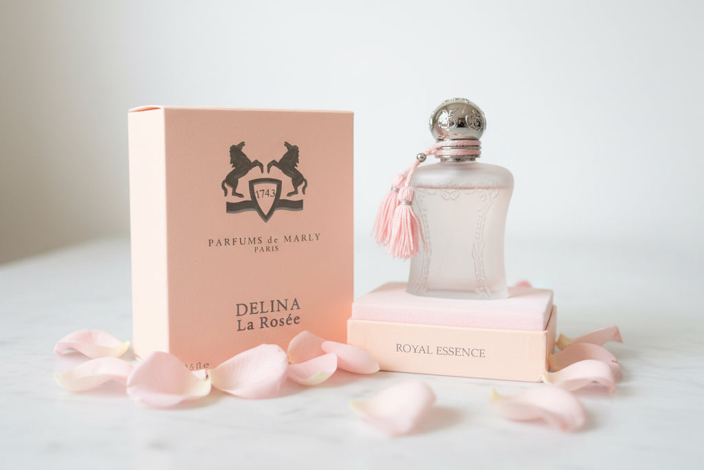 Parfums de Marly Delina La Rosée perfume bottle and packaging on a textured surface